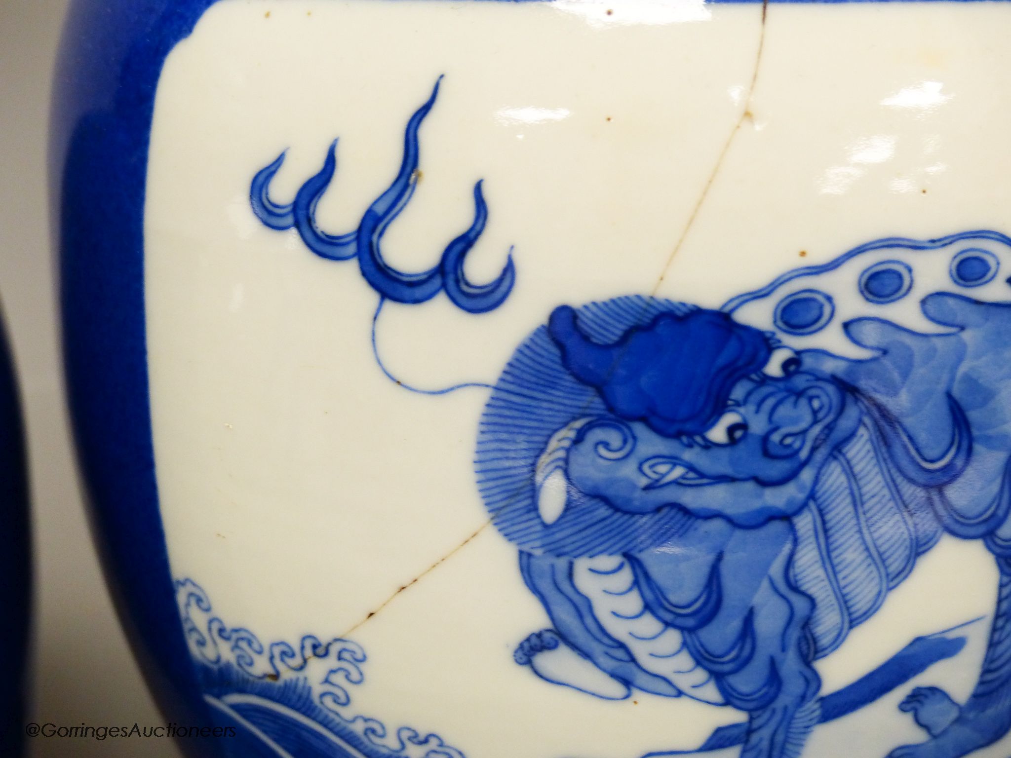 A pair of 19th century Chinese blue and white 'mythical beast' jars